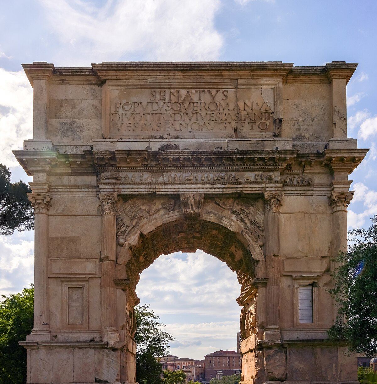 Arch of Titus in Roman Forum showcasing ancient Statuario marble craftsmanship